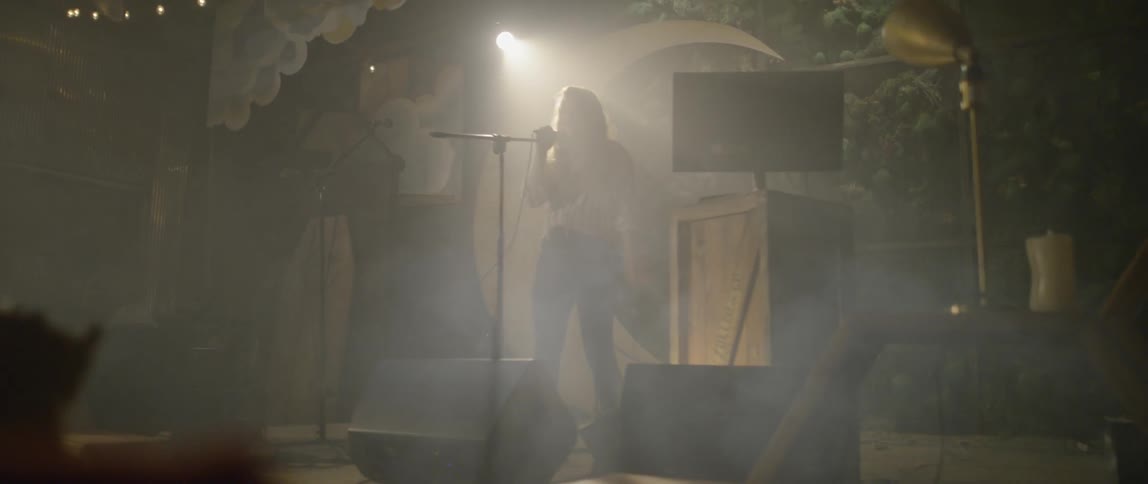 A singer performs on stage
