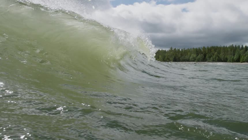 A wave is crashing towards shore