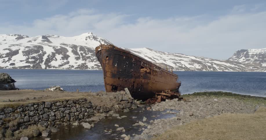 An old rusty shipwreck has washed ashore