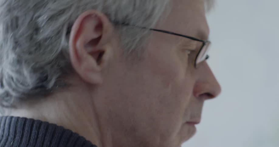 A middle aged man wearing glasses