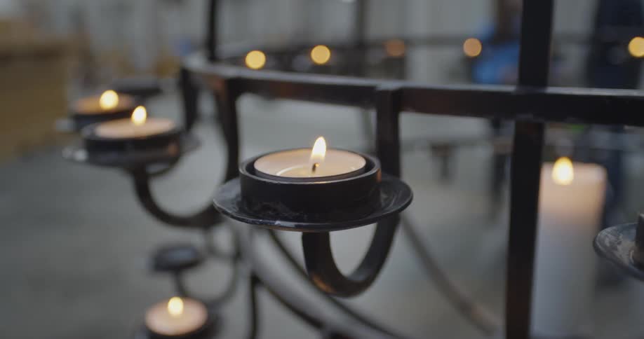 Candles are on a chandelier in church