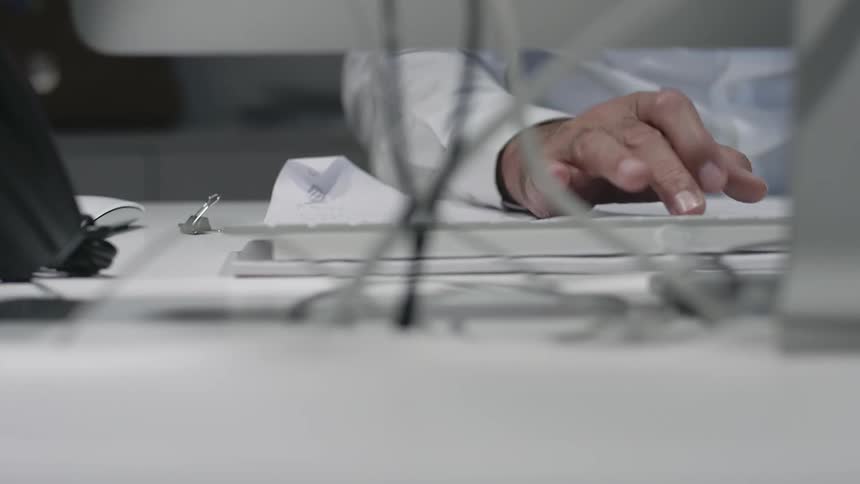 A person typing on a keyboard