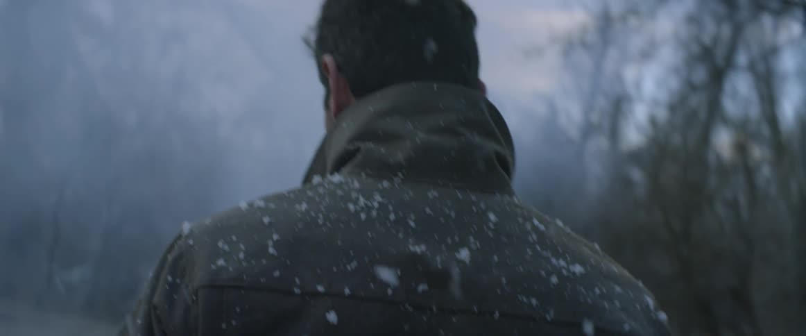 A man walks through the snow