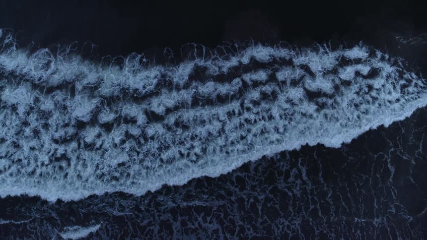 Small waves are crashing ashore
