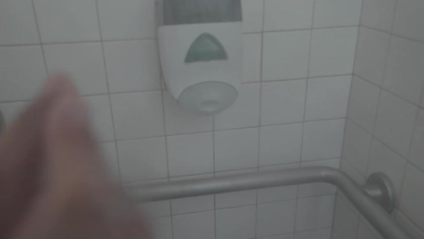 Someone is in the shower washing themselves with soap