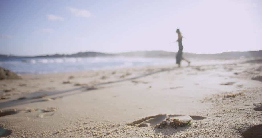 A person walking on the beach