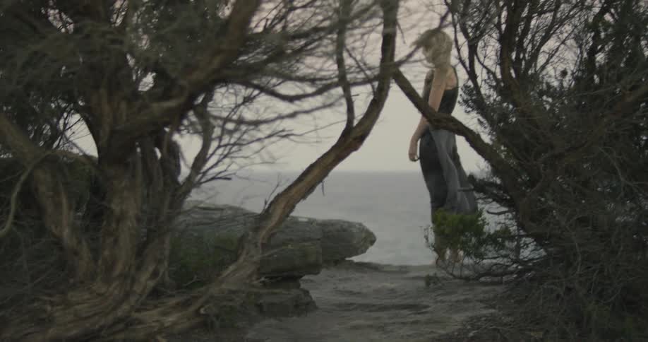 A person standing outside in the wind