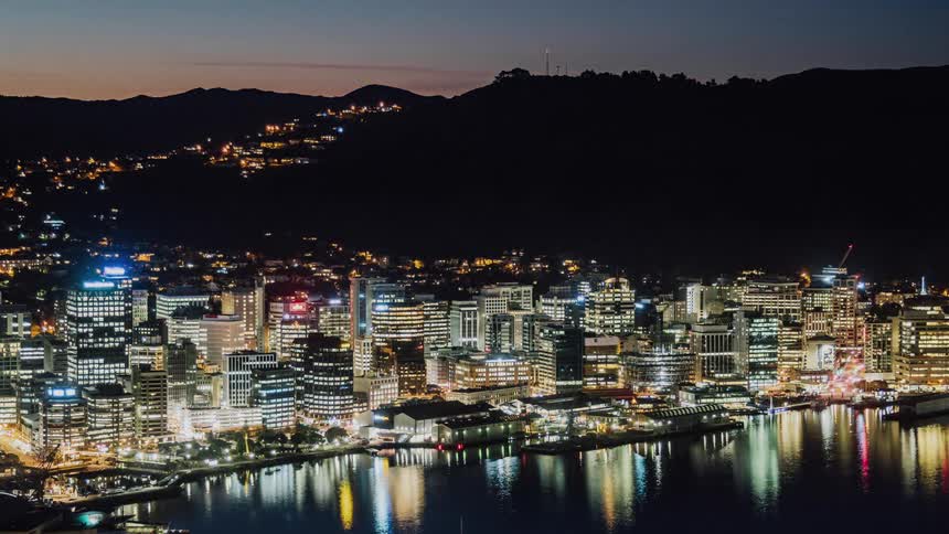 A brightly lit city at sunset