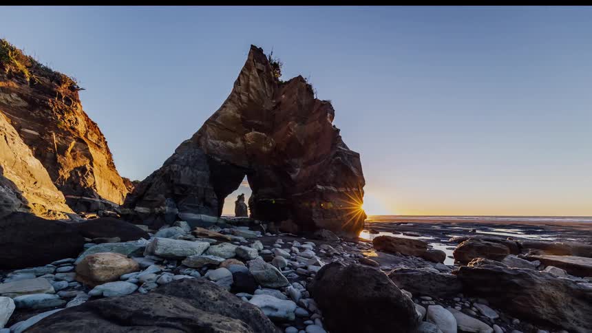 Rock formations in and near the sea at sunset