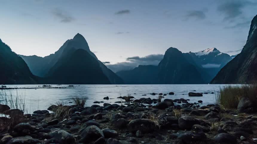 A lake in the mountains at sunset