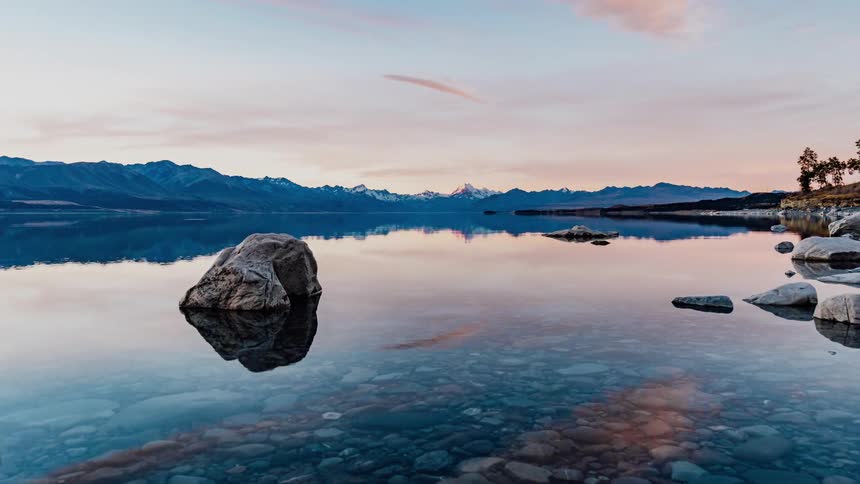 Clouds go by quickly and the reflection is mirrored in the still waters