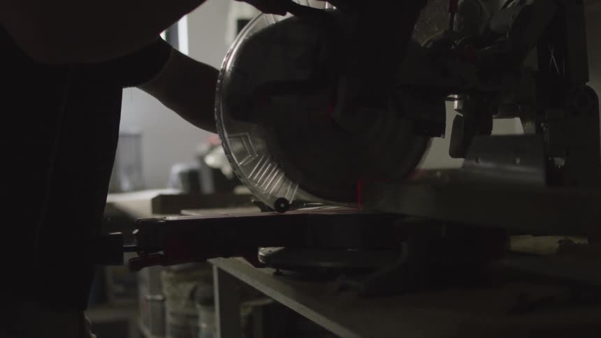 A person using a saw