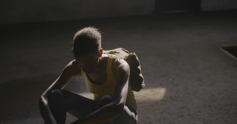 Woman rocks while sitting on a floor