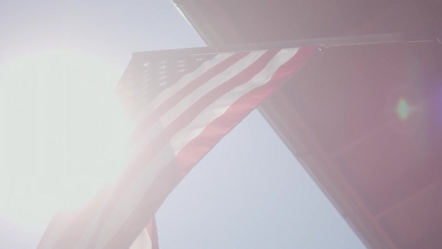 An american flag waves in the breeze