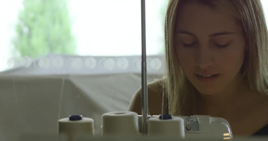 A person using a sewing machine