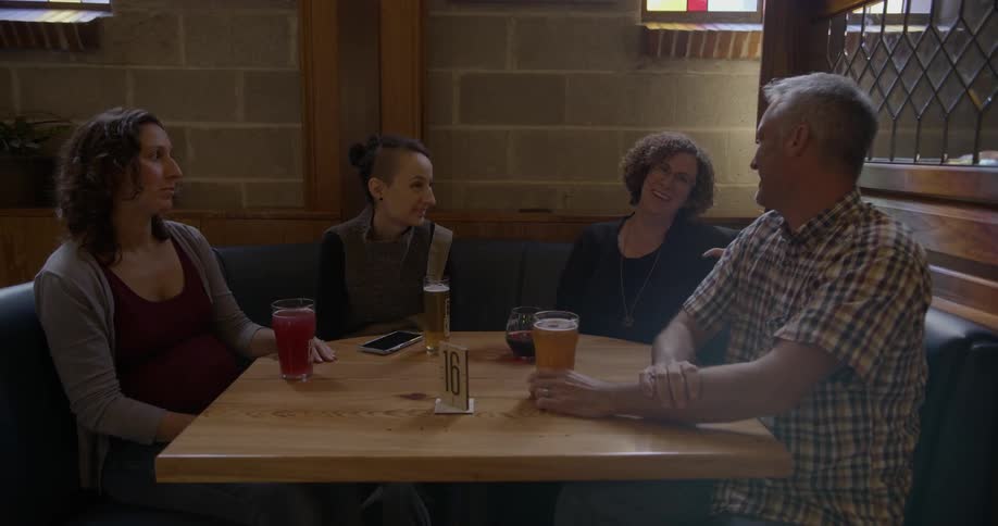 People sitting and talking at a restaurant table