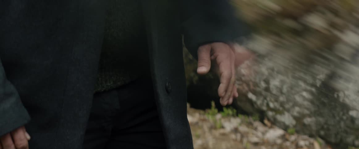 A man uncontrollably shakes his hand
