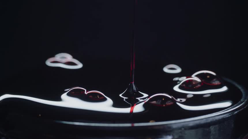 Blood is being poured into a pan and overflowing