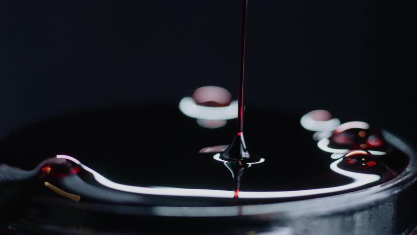 Blood is being poured into a jar