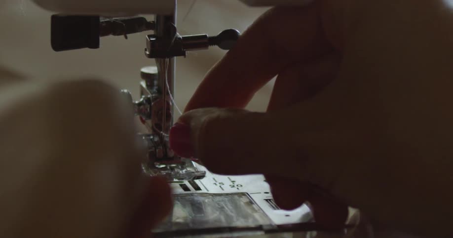 A person using a sewing machine