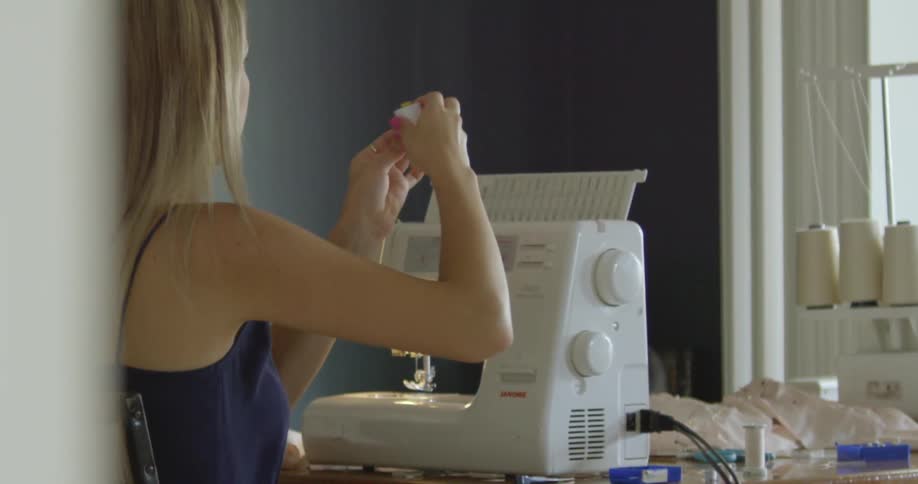 A person using a sewing machine