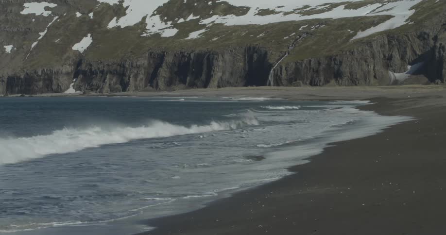 Ocean waves wash ashore a beach
