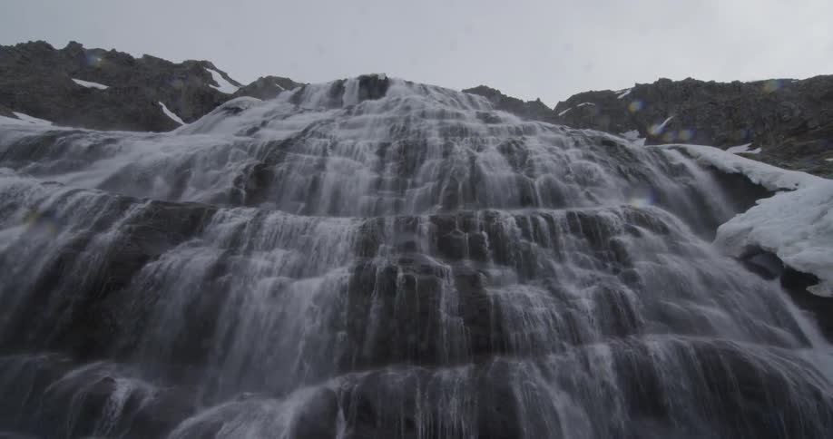 Water rolling down a large rock or cliff