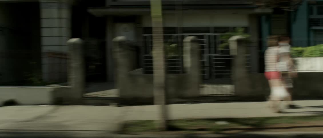 Driving past people in a city