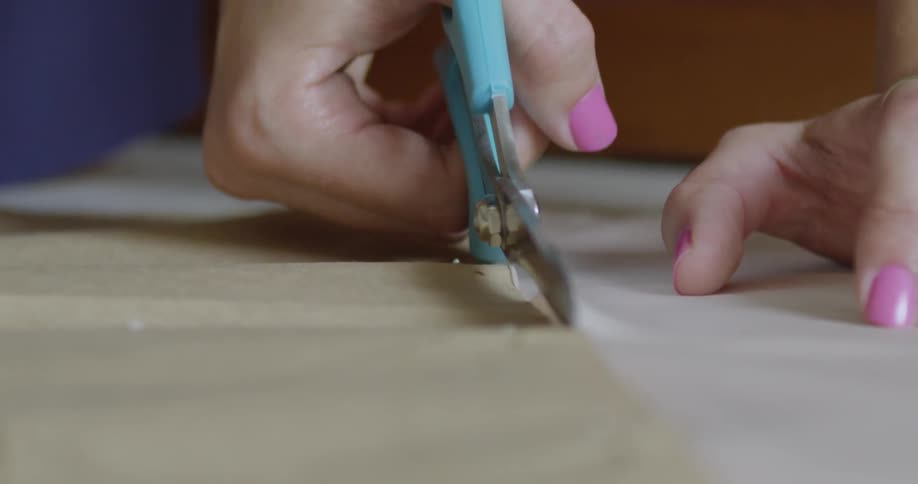 A person cutting paper