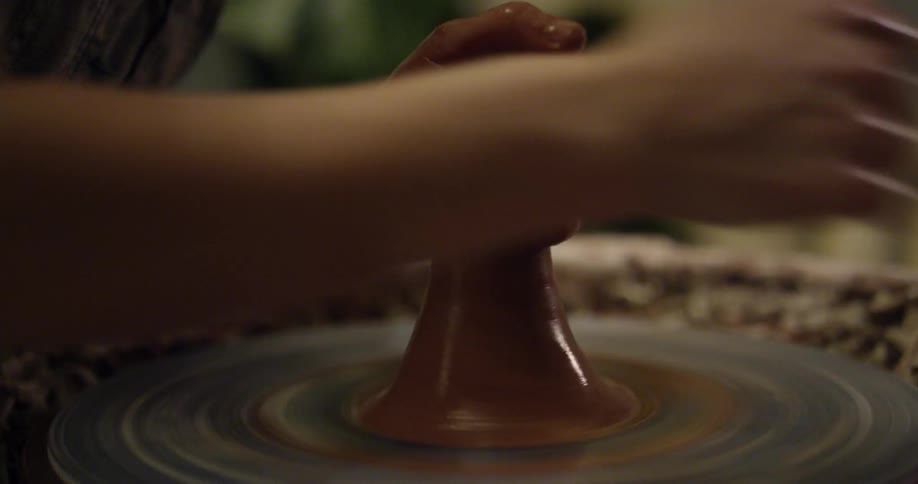 A potter spinning clay