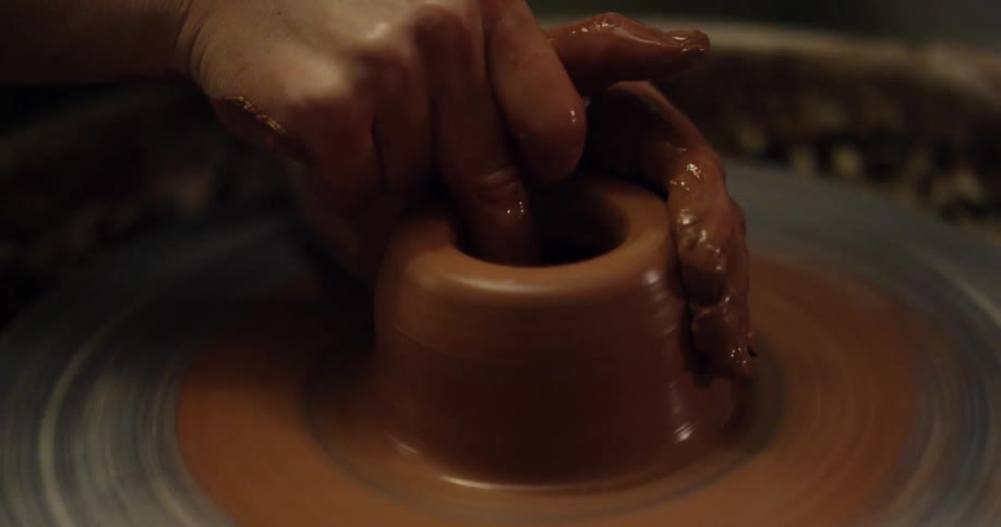 Someone is making a clay pot