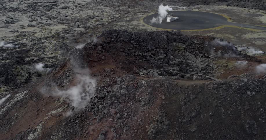 Steam rises from the side of a volcano
