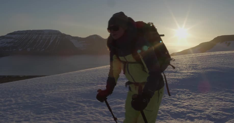 Someone is skiing on a snow covered mountain
