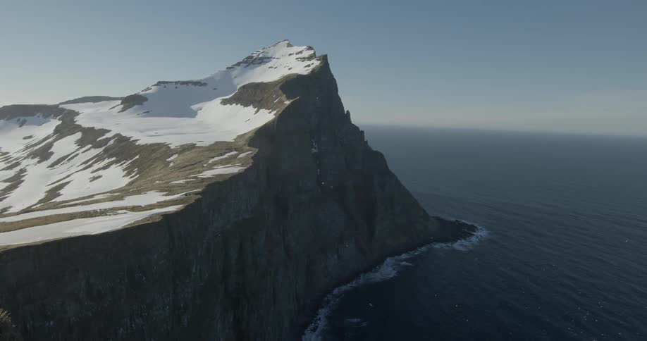 The island has a steep cliff leading to the ocean
