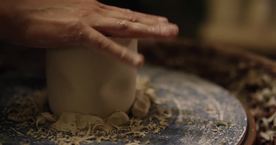 Clay is shaped on a pottery wheel