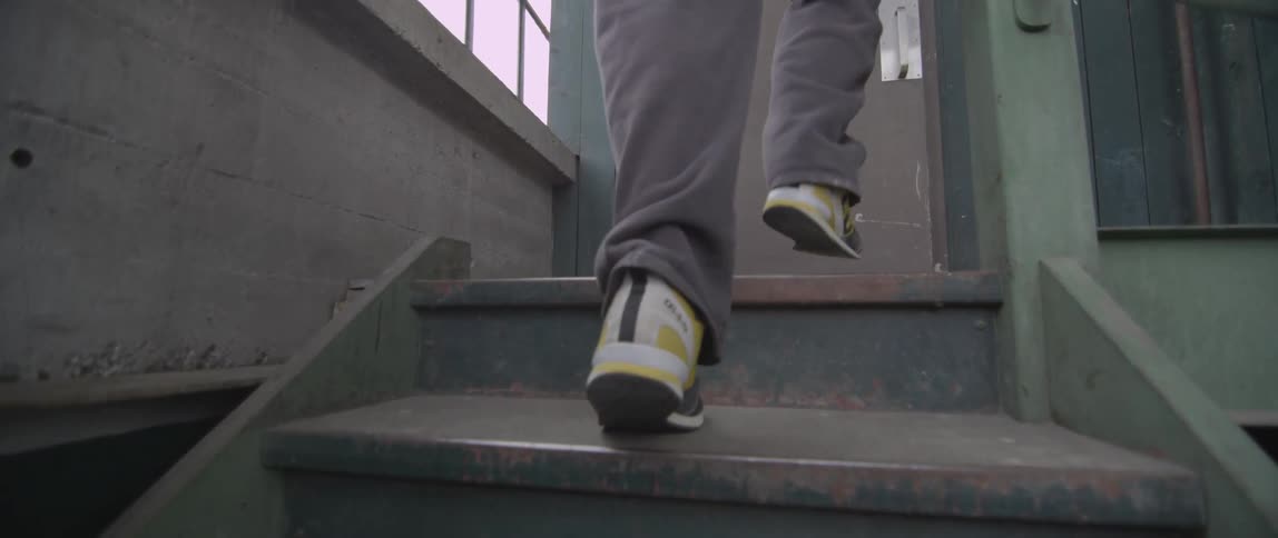 A person walking up a flight of stairs