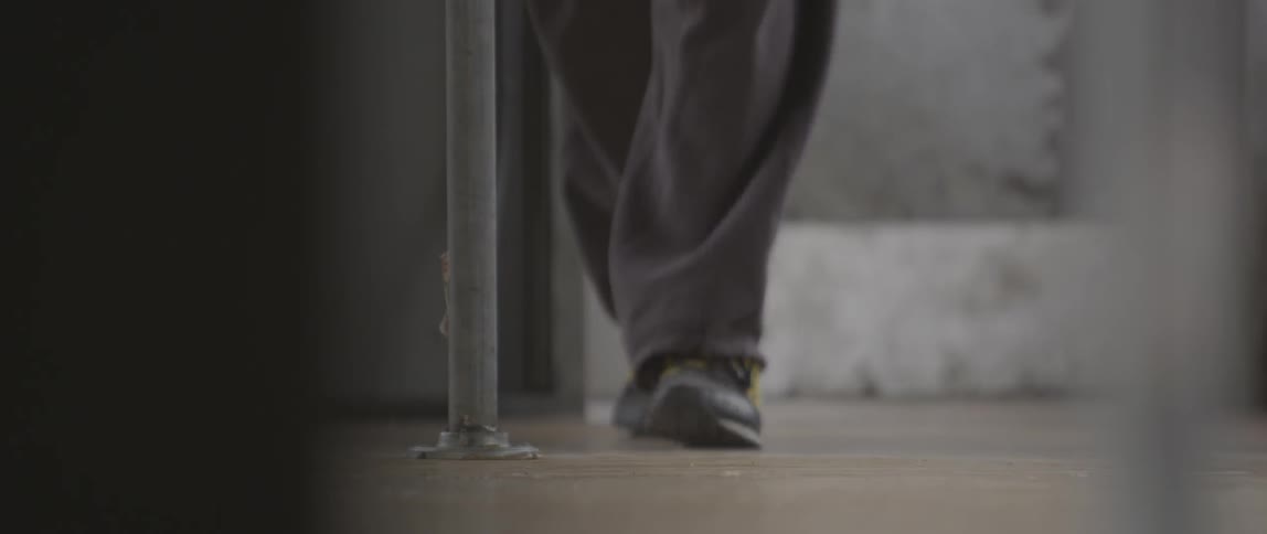 A person walking thru a doorway