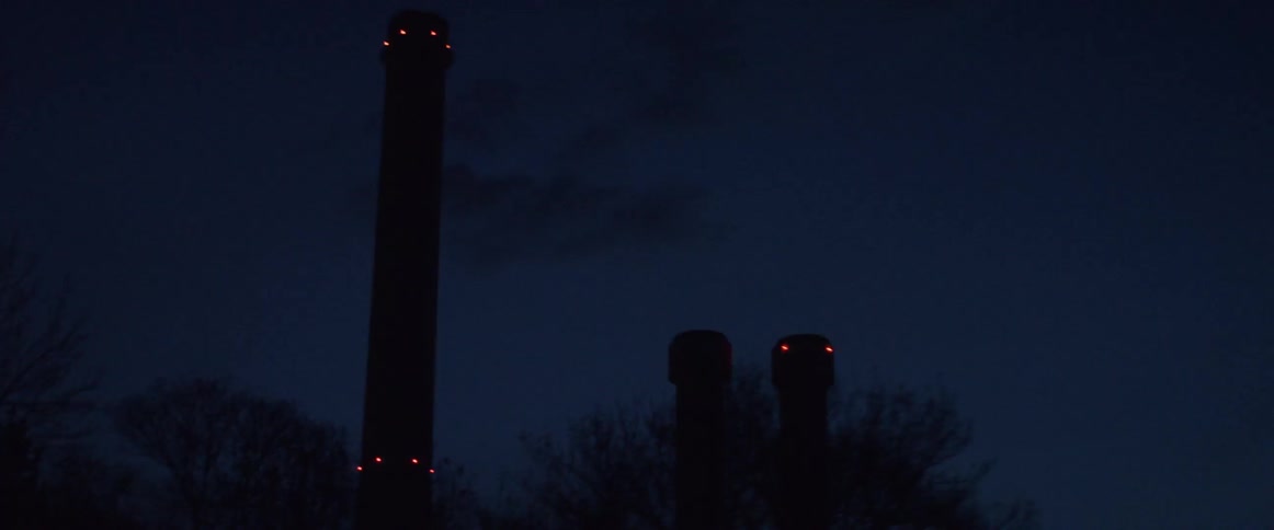 Smoke stakes are viewed from a passing car