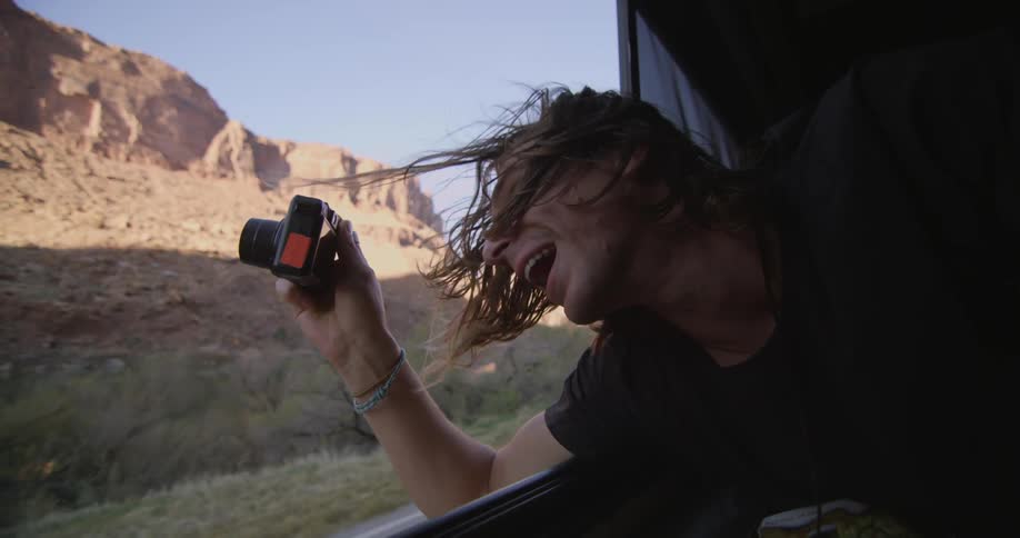 A person taking pictures of nature