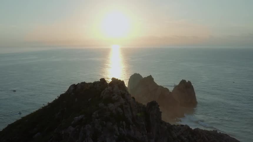 The sun rising over the ocean