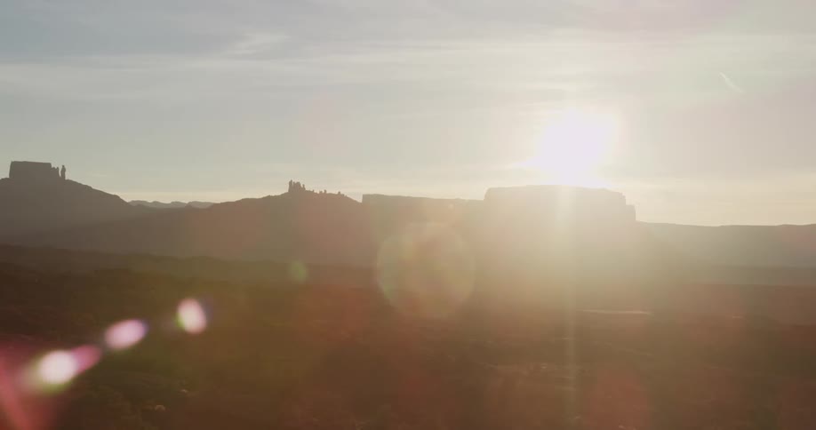 Sun setting over a desolate  mountainous region