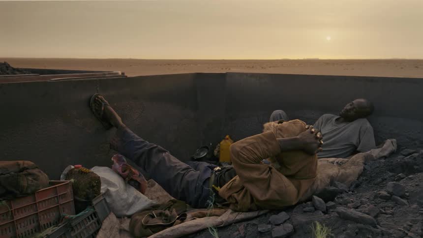 Two men sleeping in a train cart