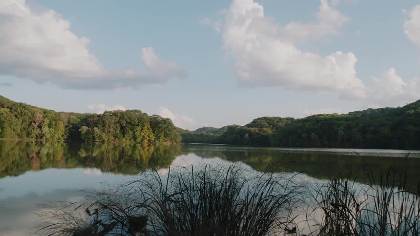 Clouds float above a rural lake