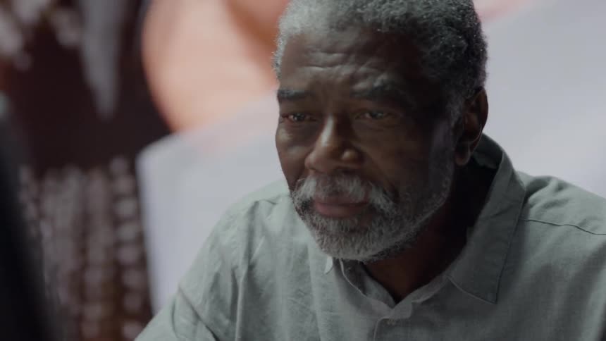 An older man working on computer