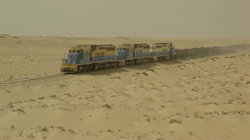 A train travels through the desert