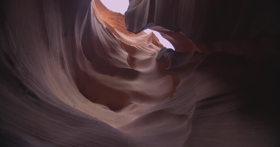 A rock formation towers overhead in the desert