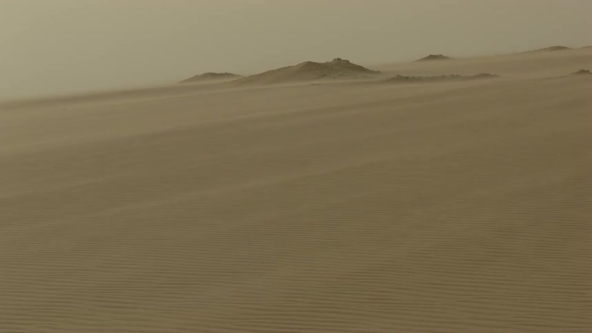 Wind blows across a sandy desert