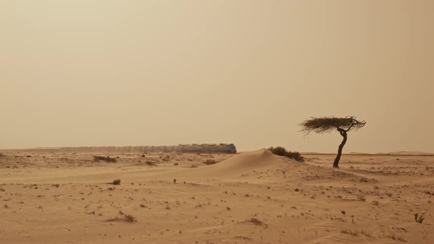 A train speeding through the desert