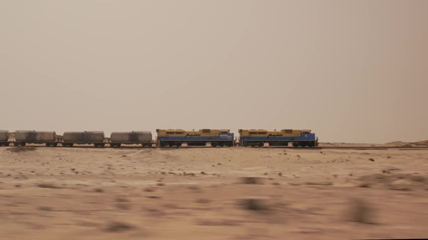 A train speeding through the desert