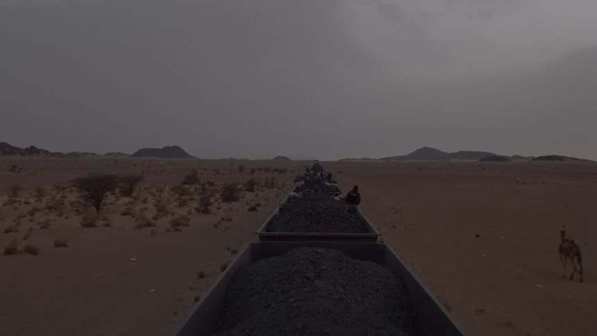 The long row of trailers are full of coal being transported